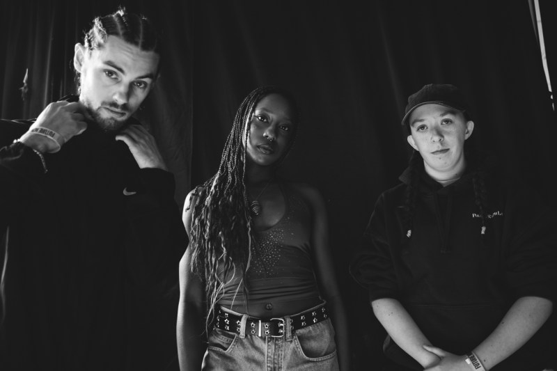 Steel, 3 piece band standing looking into the camera